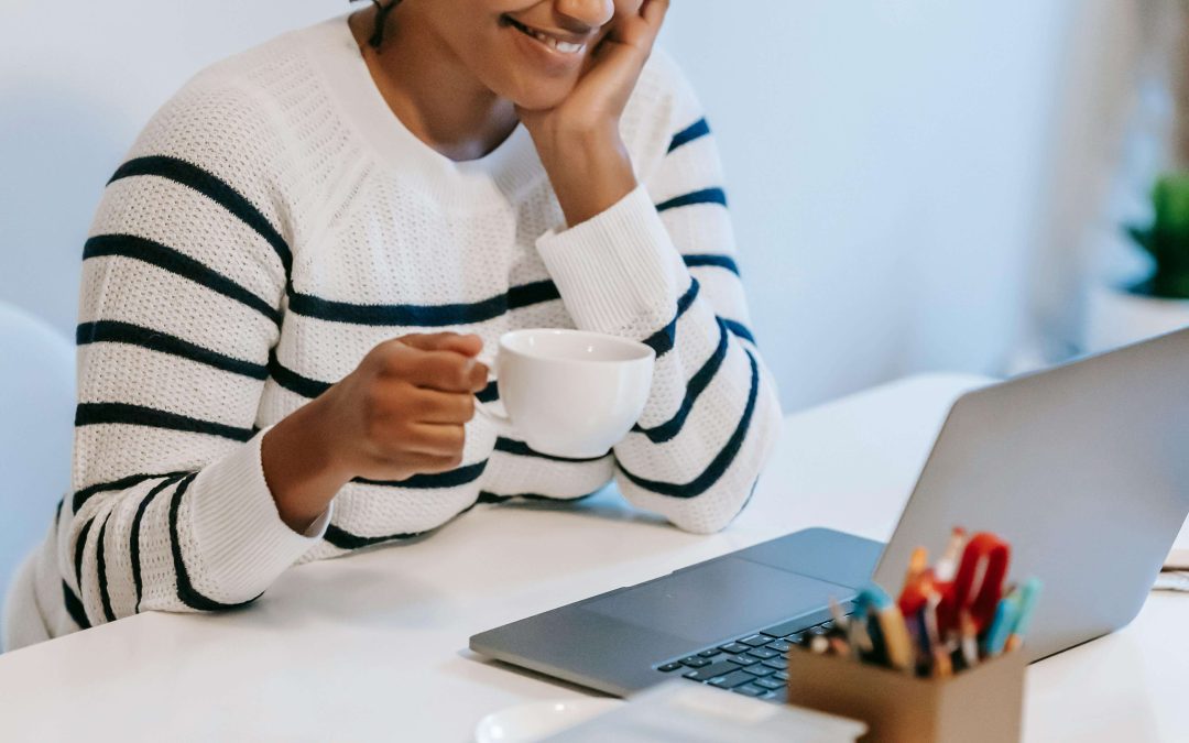 woman drinking coffee working